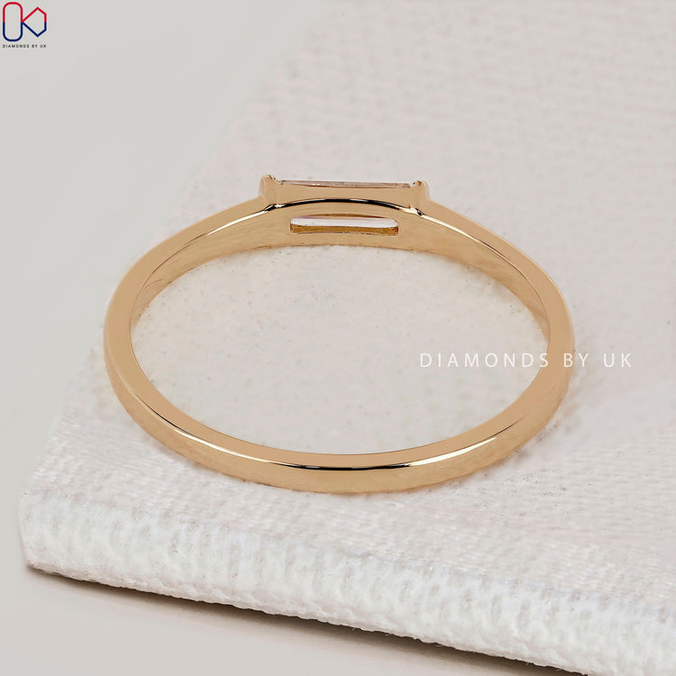 Handmade baguette cut band with solitaire setting.