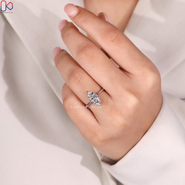 Compass prong marquise ring with cathedral setting.