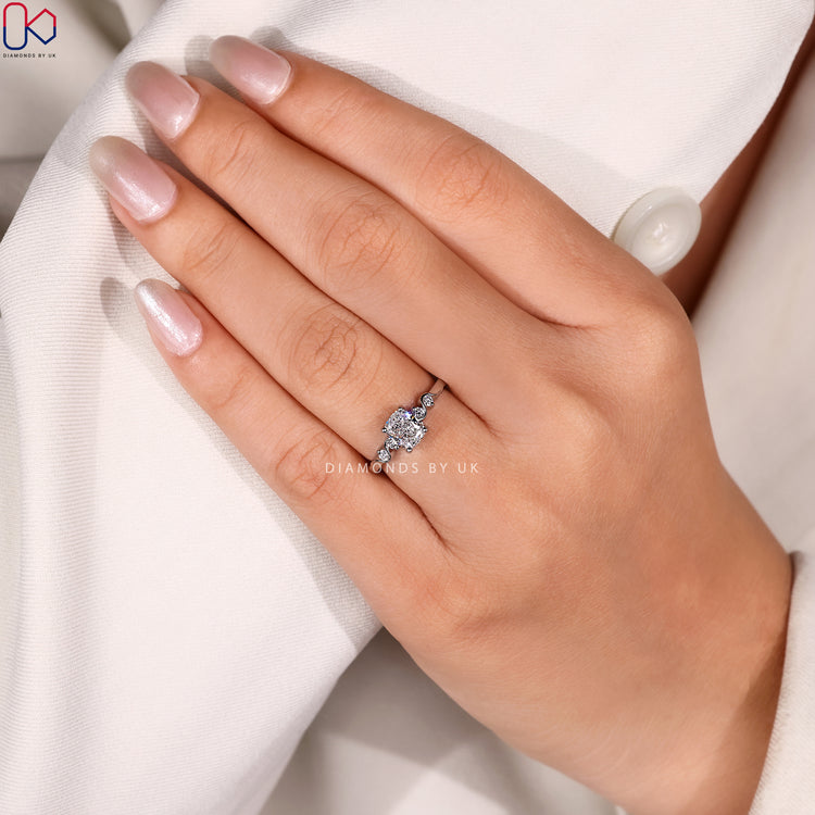 Cushion cut diamond ring with five stone style.
