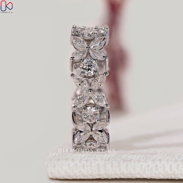 Round and marquise diamond eternity band with prong setting.