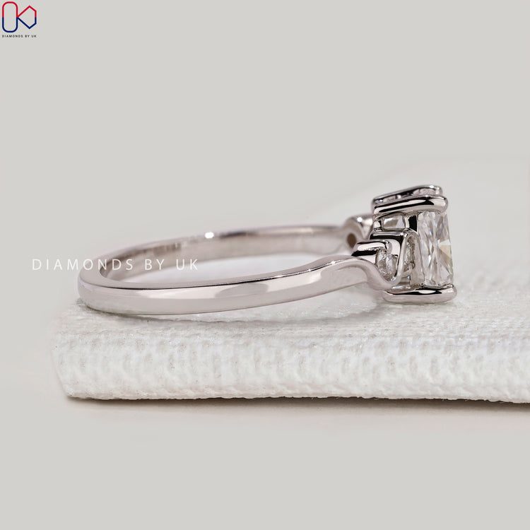 Handmade cushion ring with four claw prong setting.
