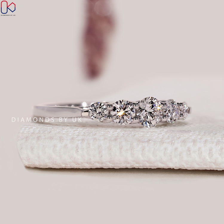 Round diamond half eternity band with five stone style.