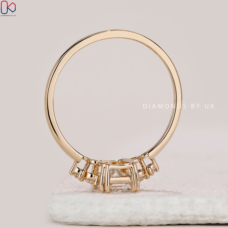 Radiant cut ring with five stone side diamonds.