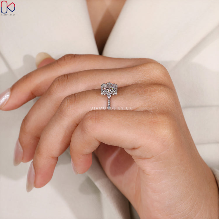 Lab grown princess ring with halo and tapered shank.
