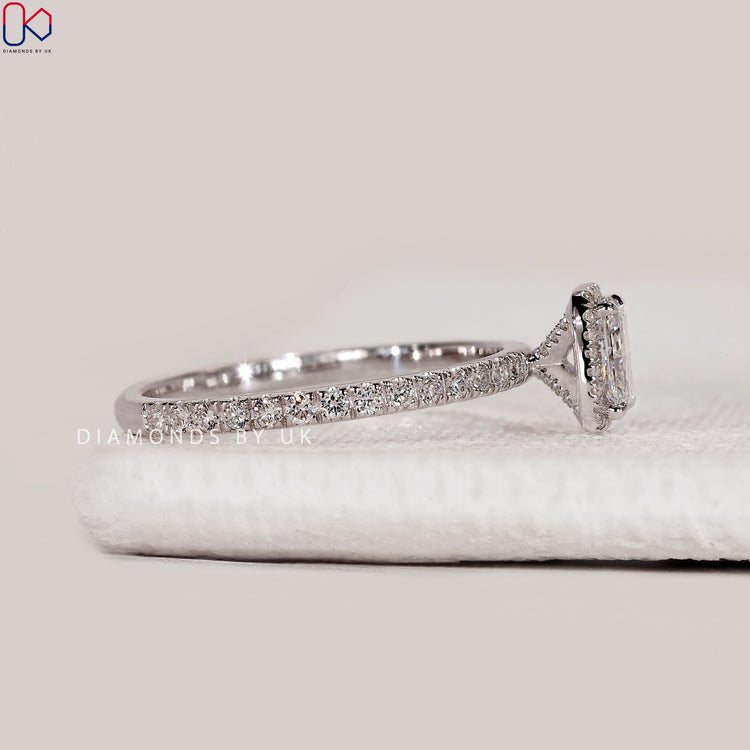 Handmade radiant cut ring with four claw prongs.