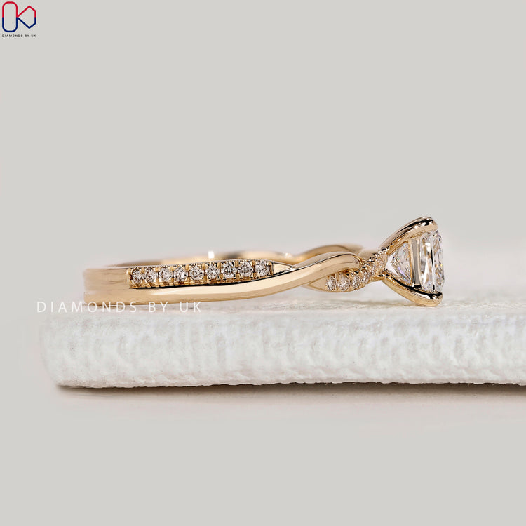 Handmade princess cut ring with four claw setting.
