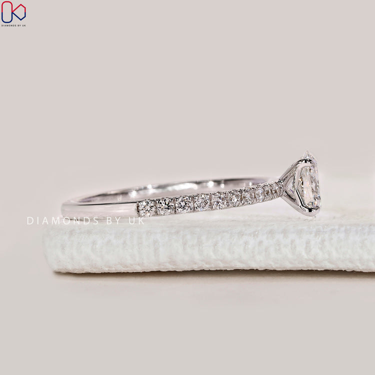Handmade oval cut ring with four claw setting.