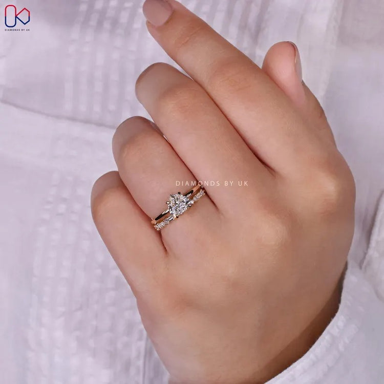Heart cut ring with baguette and round diamond band.