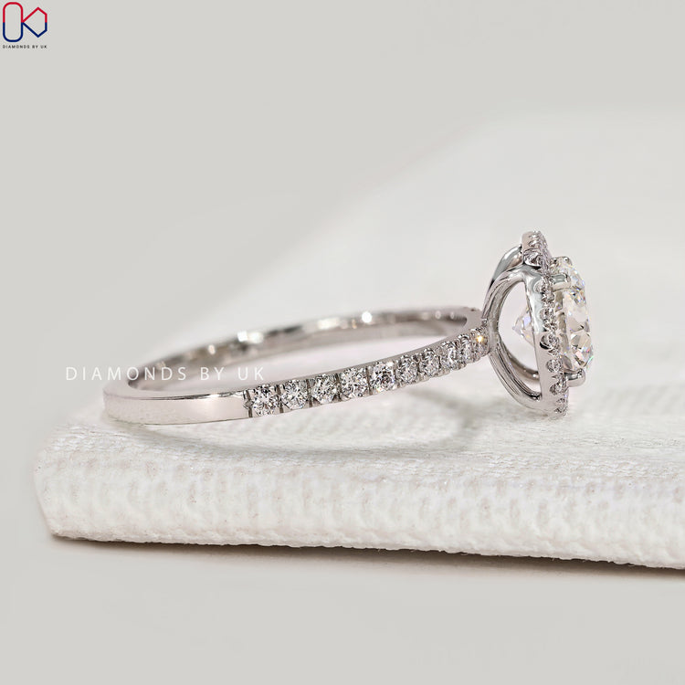 Handmade round ring with four claw prong setting.