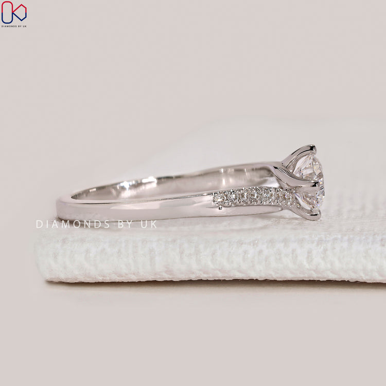 Handmade round cut ring with compass prongs.