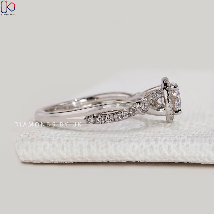 Handmade round ring with four prong setting.
