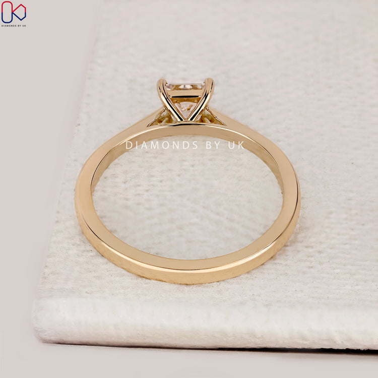 Princess cut ring with tapered shank design.