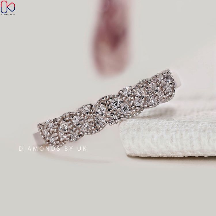 Round diamond band with marquise shape outline.