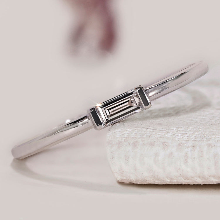 Baguette diamond band with a half bezel setting style.
