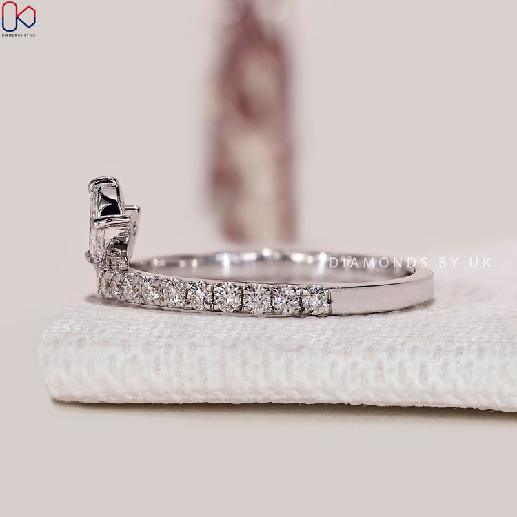 Half eternity marquise and round diamond band with prongs.