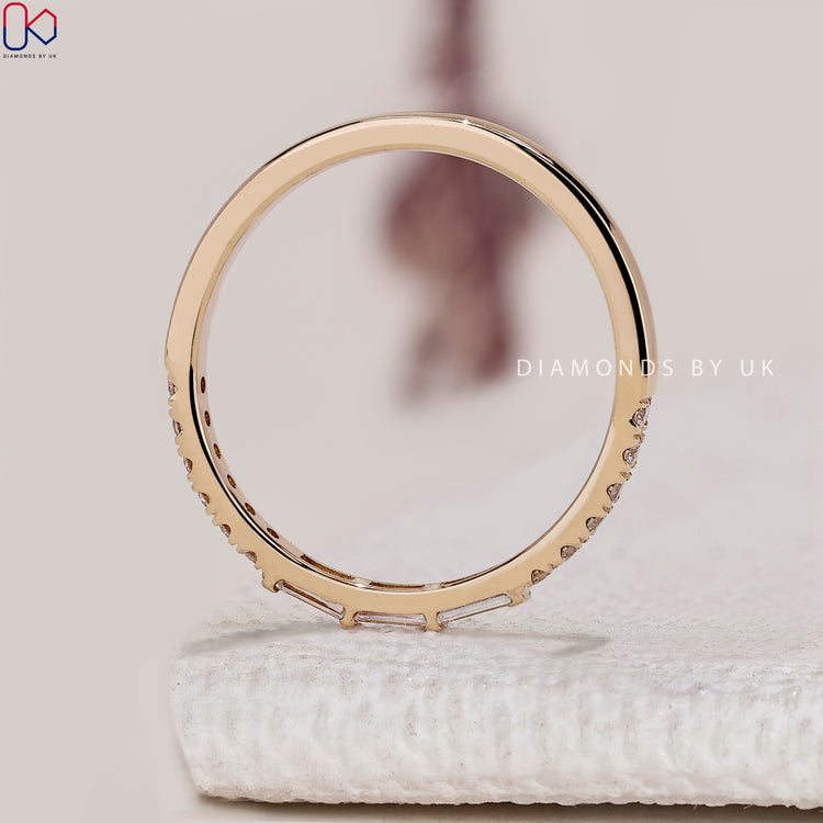 Handmade baguette and round diamond eternity band.
