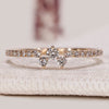 Round cut diamond wedding band with zigzag clusters.
