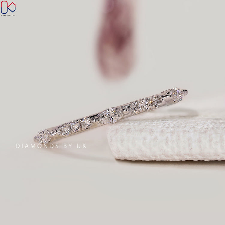 Round and marquise lab grown diamond half eternity band.
