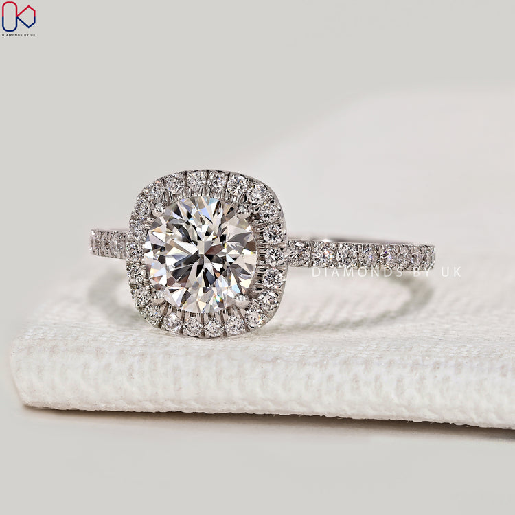 Round cut lab grown diamond ring with halo.