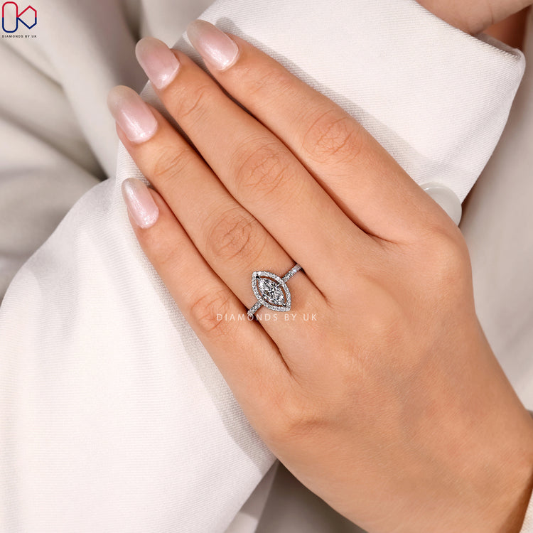 Lab grown marquise ring with halo pavé style.
