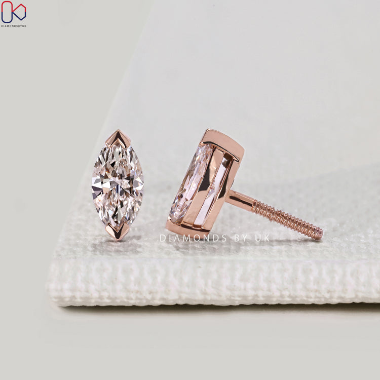 Marquise cut stud earrings with solitaire style.