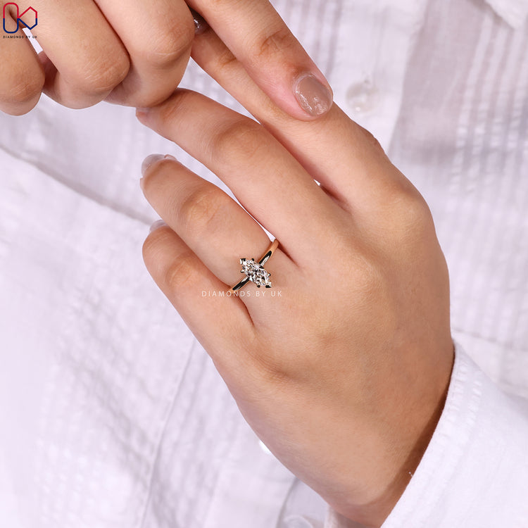 Marquise cut solitaire lab grown diamond ring.