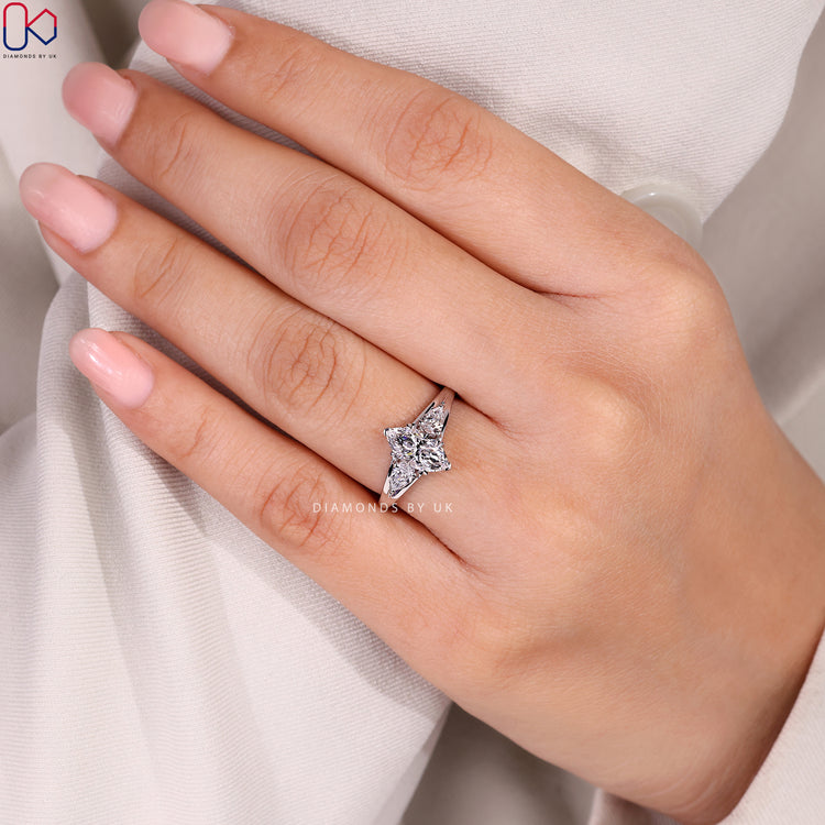 Marquise ring with V prong and split shank.