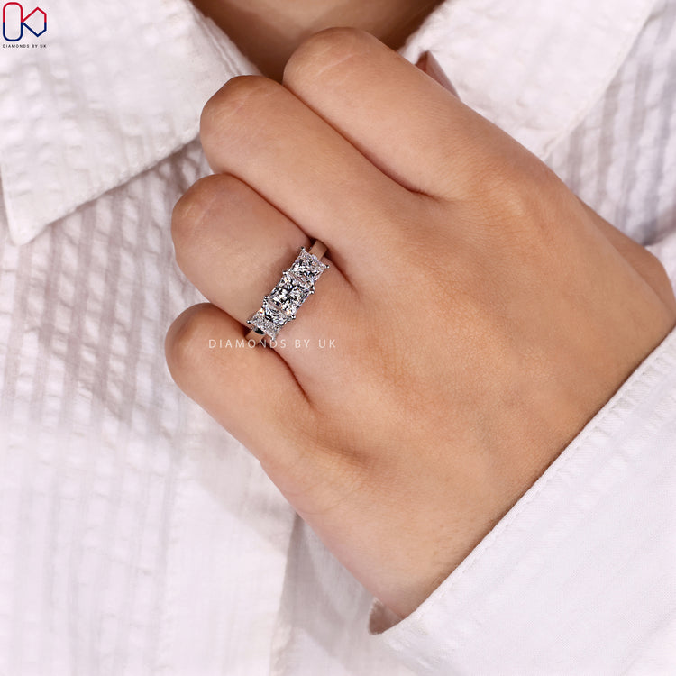 Lab grown princess cut three stone diamond ring.