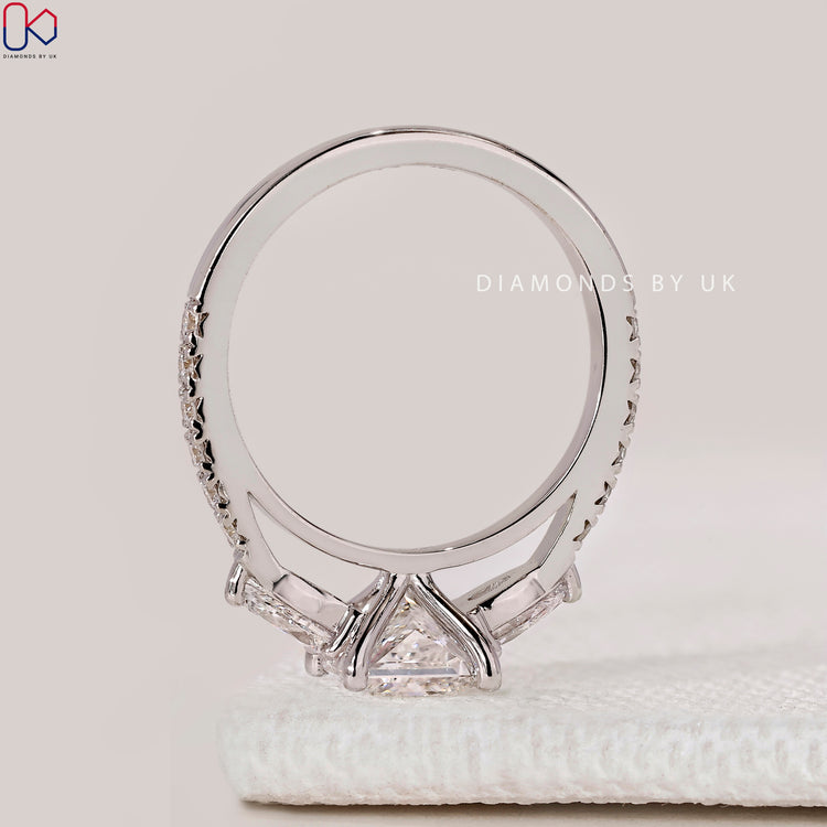 Princess cut ring with cathedral setting style.
