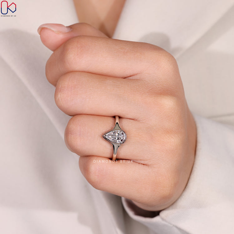 Three prong pear diamond ring with solitaire style.