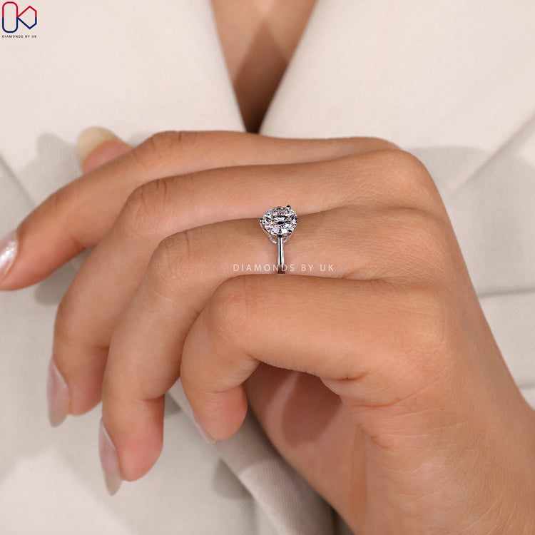 Lab grown solitaire ring with three prong setting.
