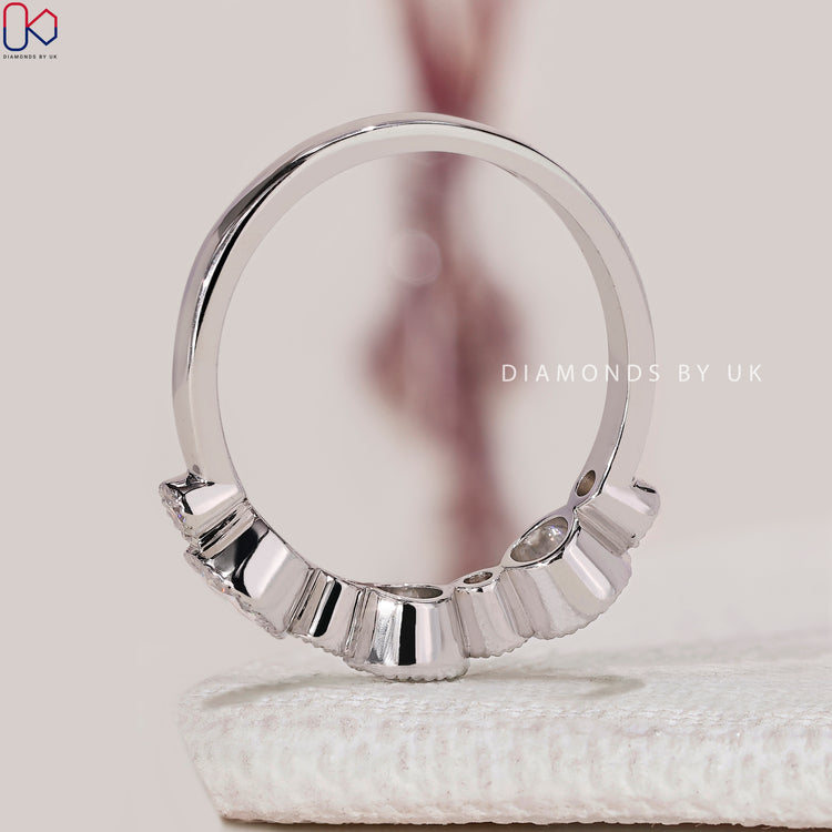 Handmade half eternity wedding band with milgrain bezel set.
