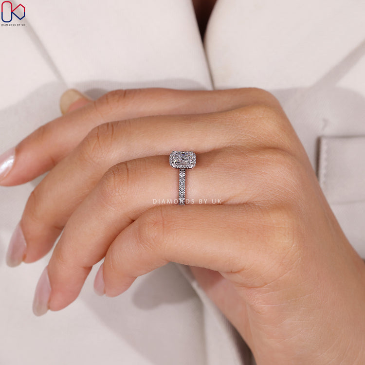 Radiant cut ring with hidden accent and halo.