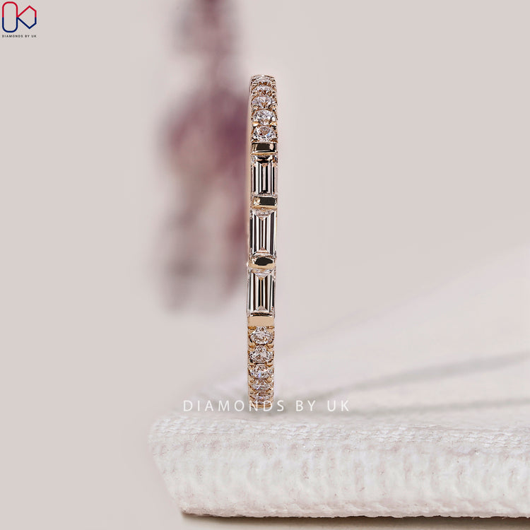 Baguette diamond band with round stones and bar setting.
