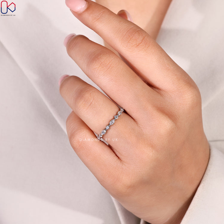 Handmade diamond wedding band by Diamondsbyuk.
