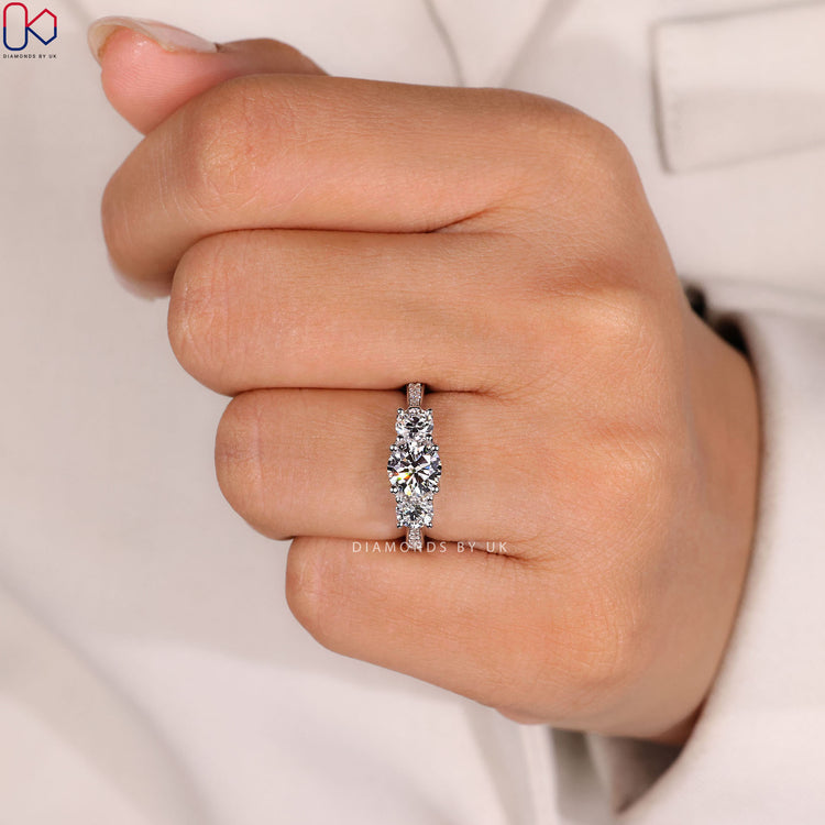 Three stone round ring with cathedral setting.
