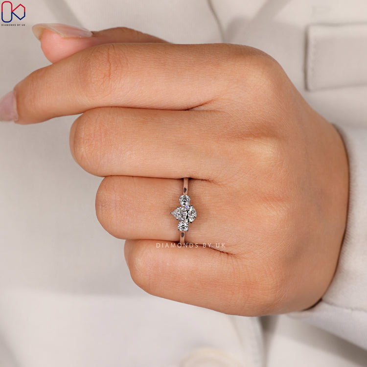 Three stone pear ring with claw prong setting.