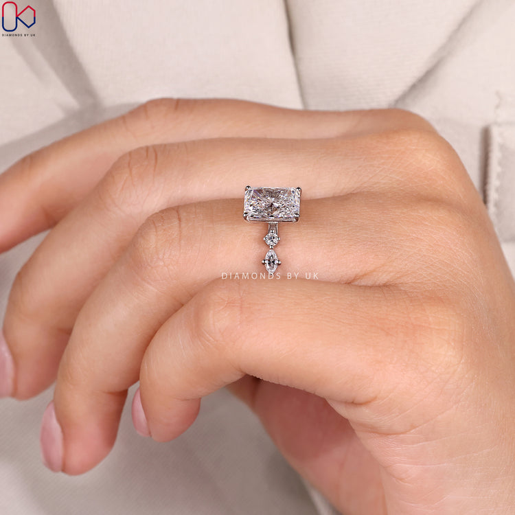 Lab grown radiant ring with shared prong pavé.