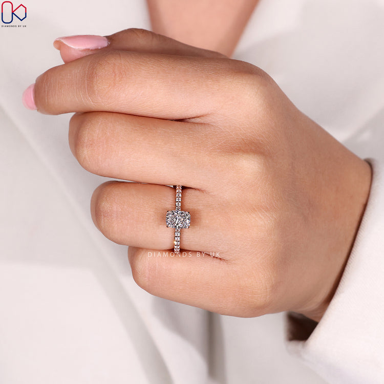 Hidden halo cushion cut ring with pavé diamonds.