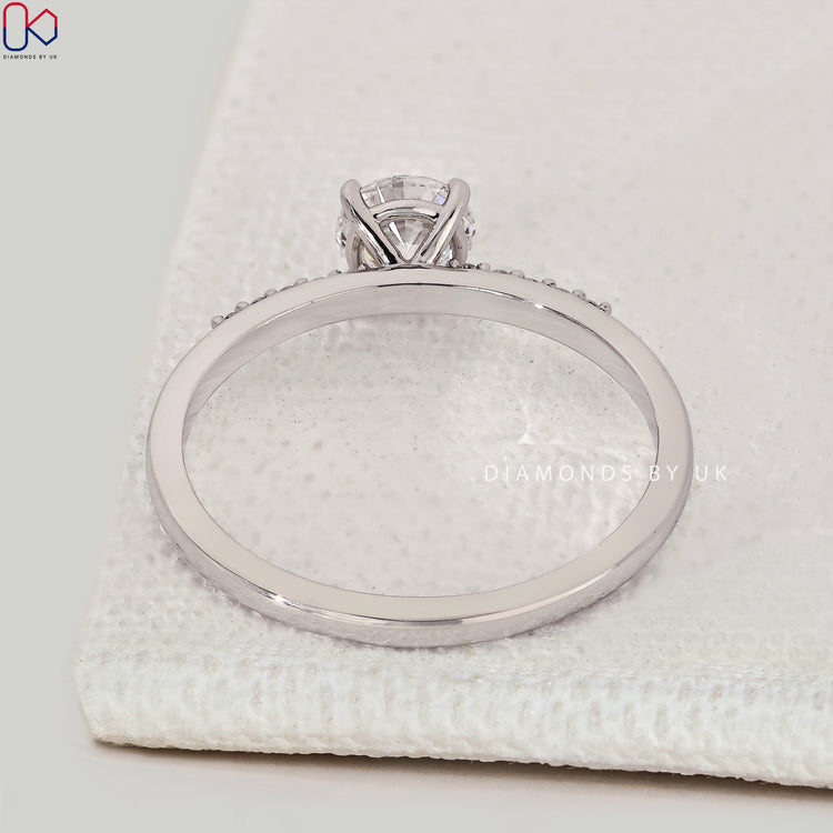Handmade round cut engagement ring with pavé style.

