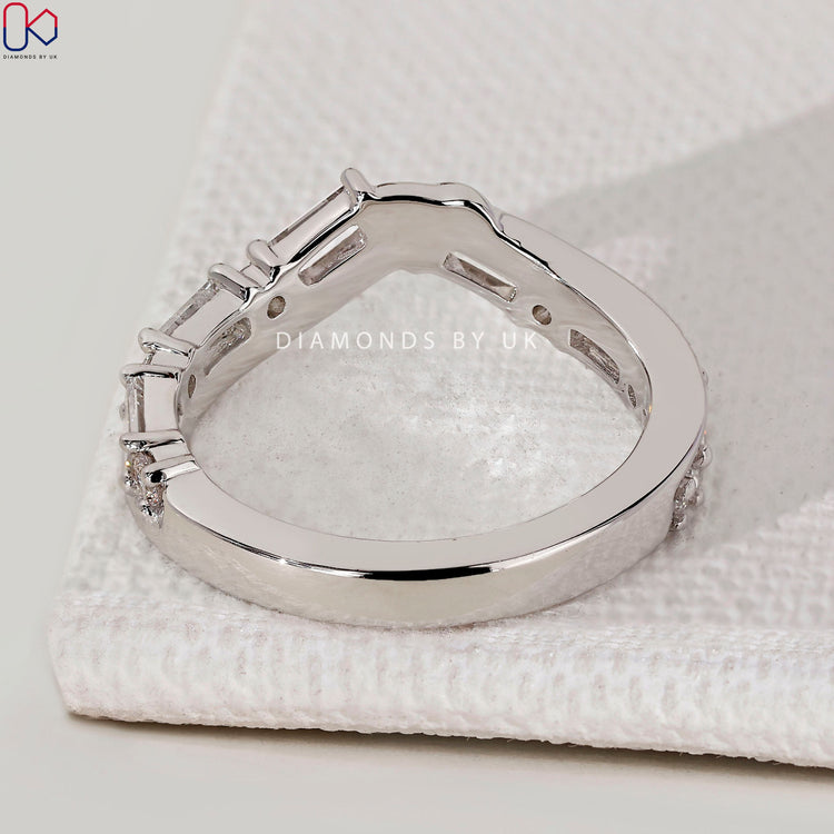 Handmade curved diamond wedding band by Diamondsbyuk.