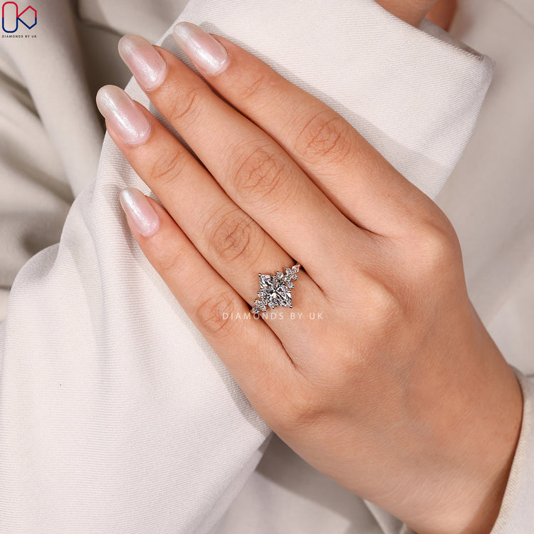 Marquise cut ring with pear and round diamonds.
