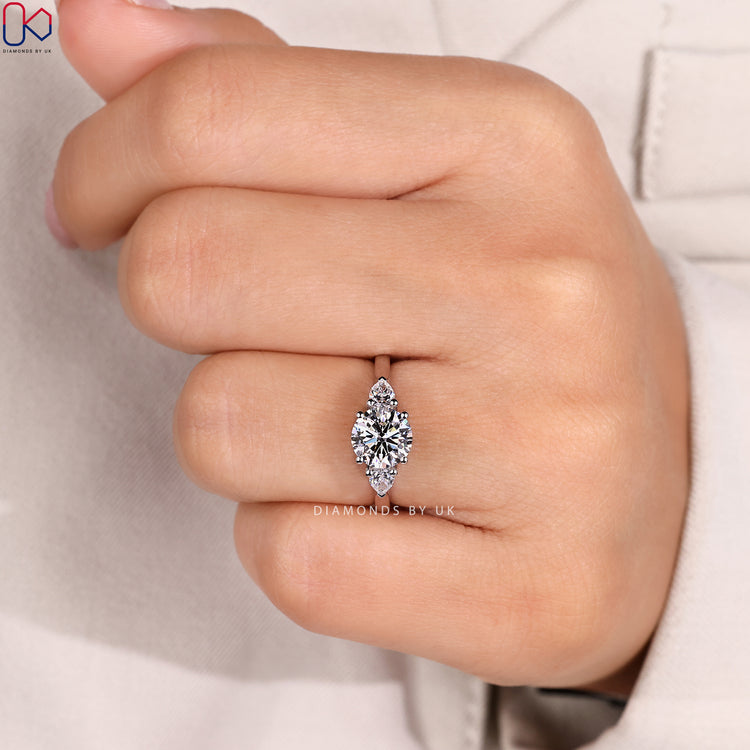 Cathedral round diamond ring with prong setting.