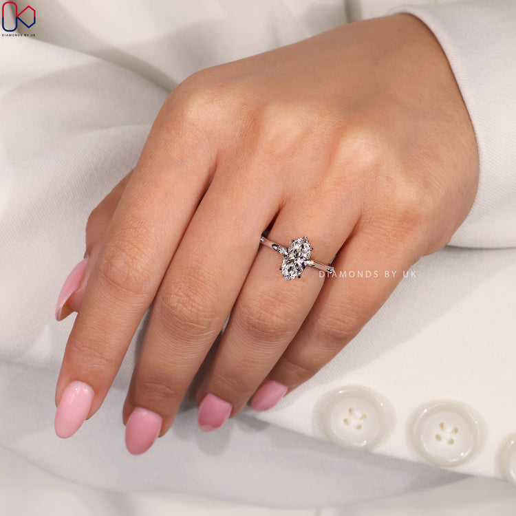 Handmade marquise engagement ring with hidden halo.
