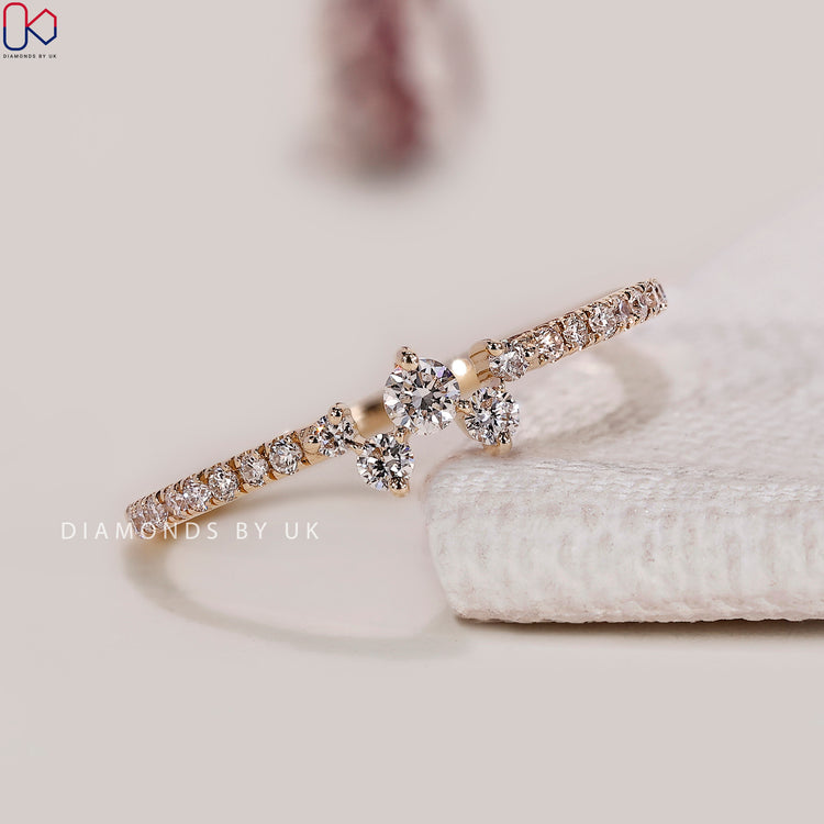 Round cut lab grown diamond band in zigzag cluster style.