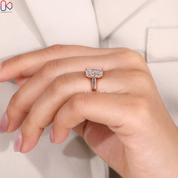Lab grown cushion solitaire ring with cathedral setting.
