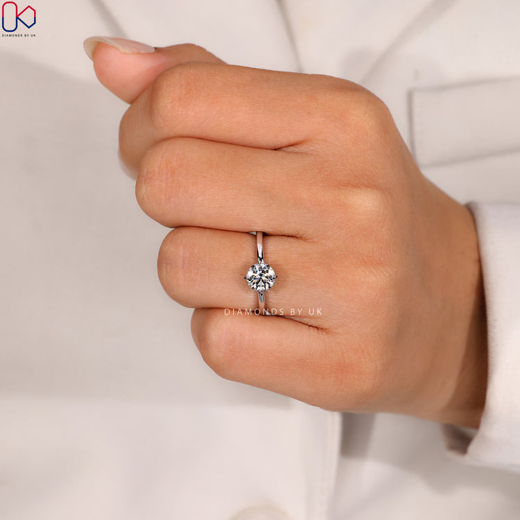 Round cut ring with four claw prong setting.