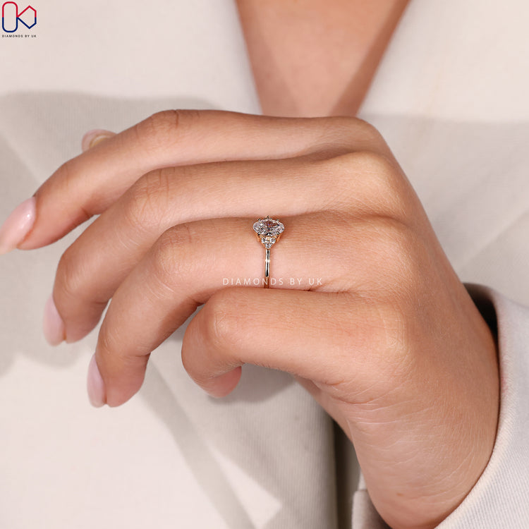 Lab grown oval cut ring with seven diamonds.