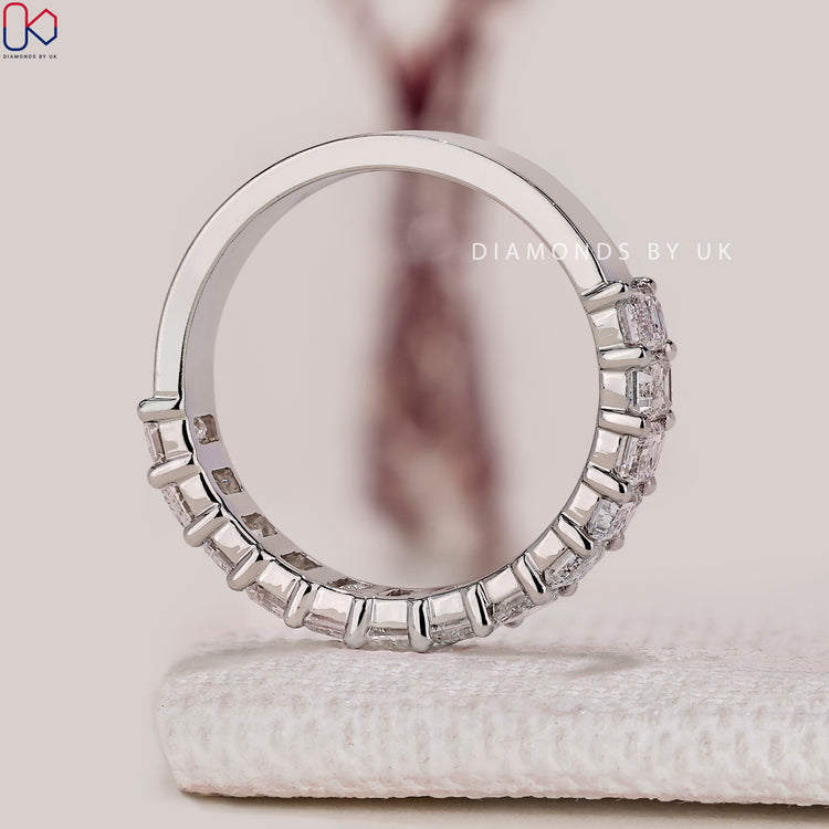 Half eternity emerald cut diamond band by Diamondsbyuk.
