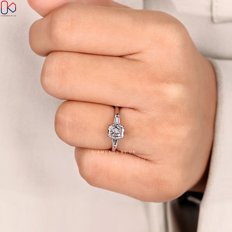 Three stone pear ring with claw prong setting.
